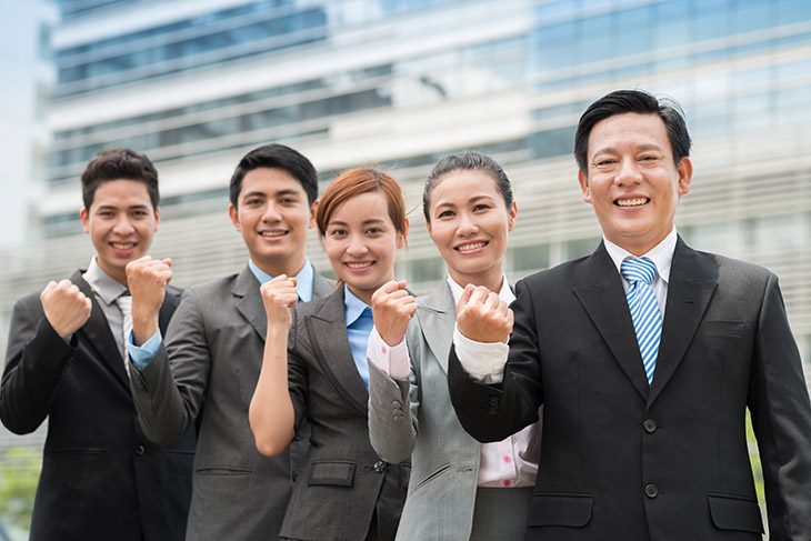 An excited group of businessmen from China